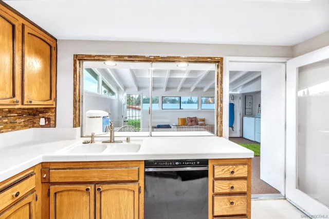 a kitchen with a sink and a window