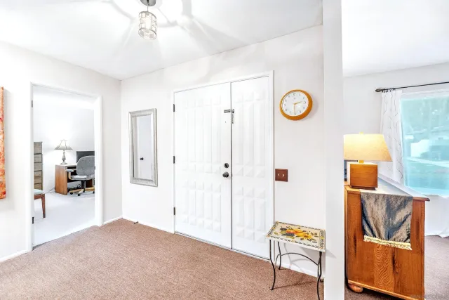 a view of a hallway view with wooden floor and staircase