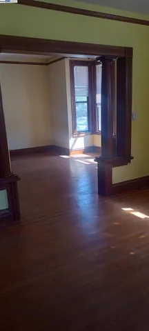 a view of an empty room with a wooden door