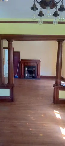 a room with wooden floor and a window