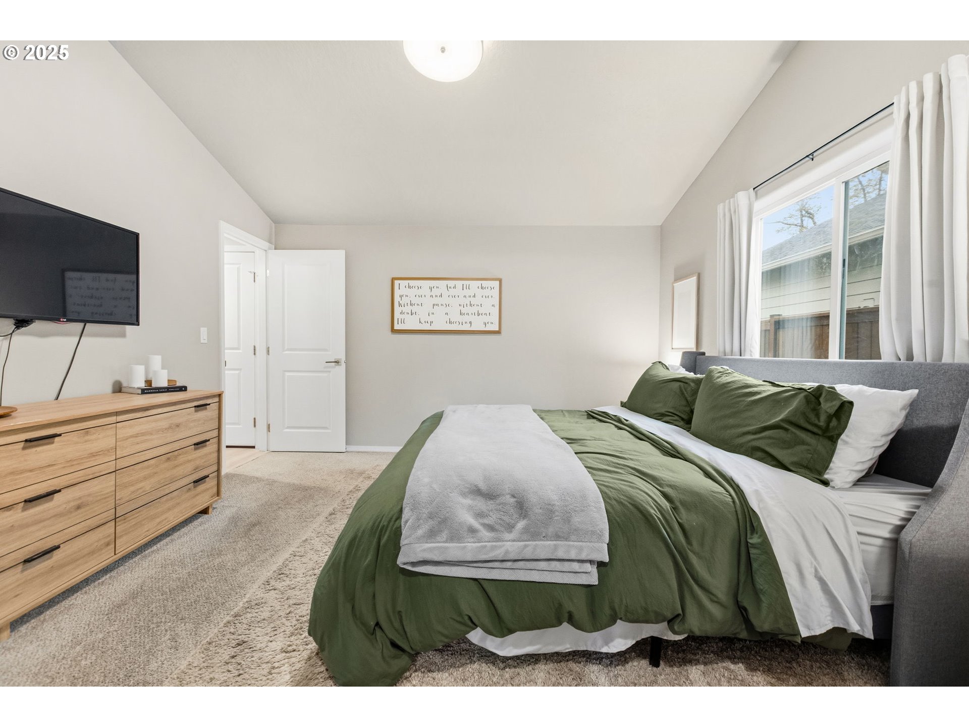 4970 Squirrel Street Springfield, OR 97478 - Photo 20 of 43 a bedroom with a bed and a flat screen tv