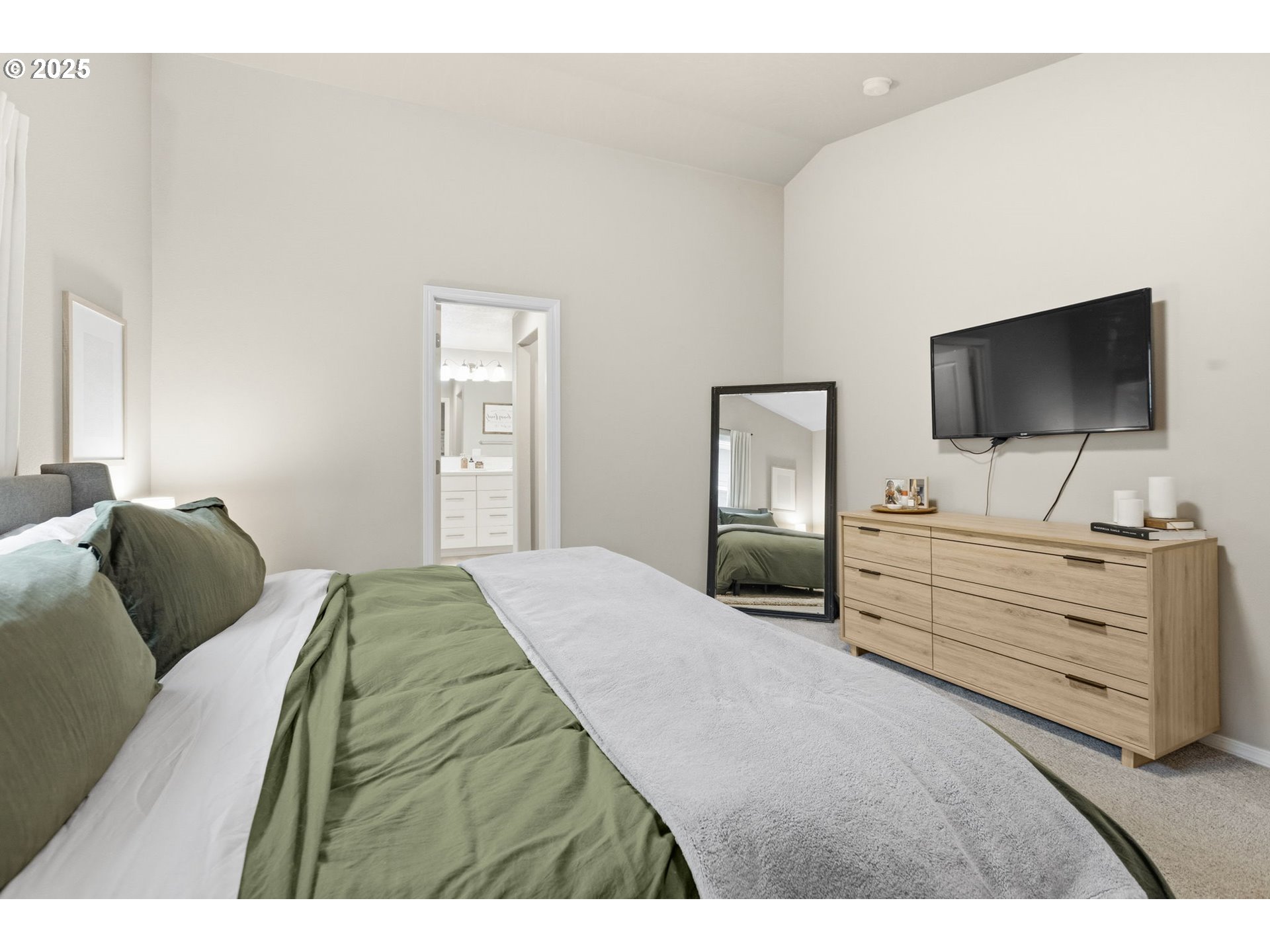 4970 Squirrel Street Springfield, OR 97478 - Photo 21 of 43 a bedroom with a bed and a flat screen tv