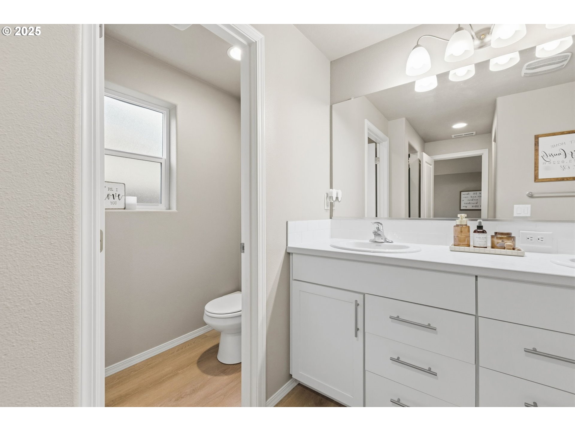4970 Squirrel Street Springfield, OR 97478 - Photo 27 of 43 a bathroom with a toilet sink and mirror