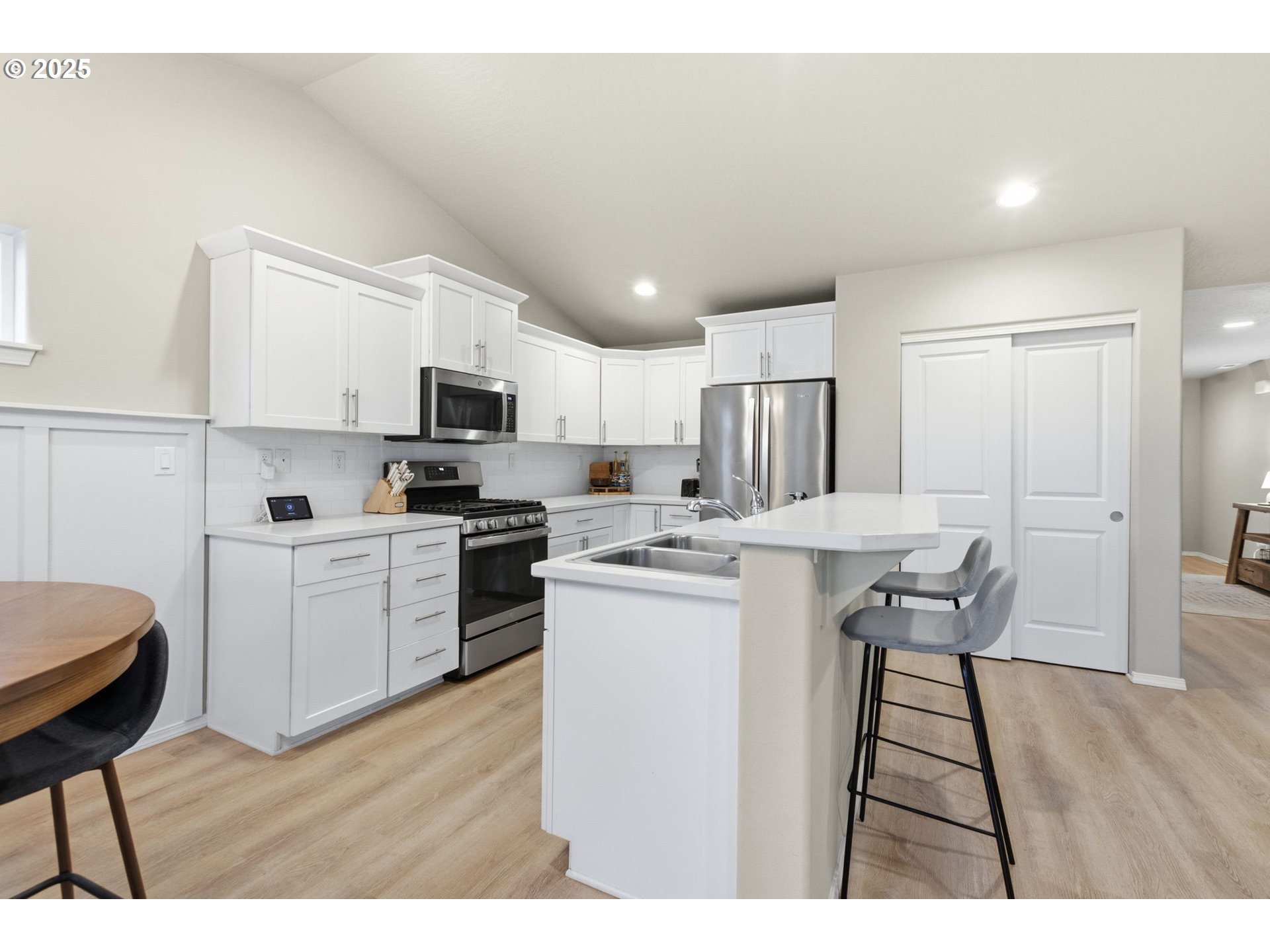 4970 Squirrel Street Springfield, OR 97478 - Photo 10 of 43 a kitchen with a sink cabinets and wooden floor