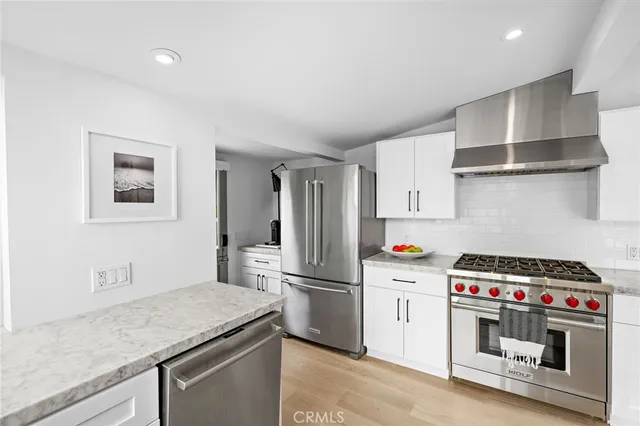 a view of a patio with couches chairs and potted plants