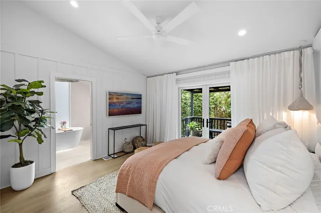 a spacious bathroom with a granite countertop sink toilet a shower and a mirror