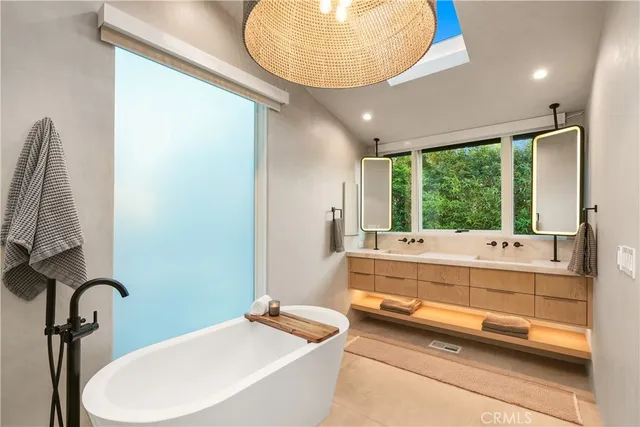 a bathroom with a toilet a sink and shower