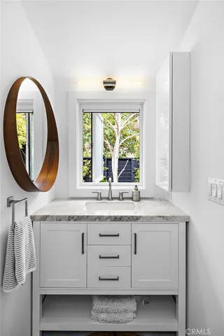 a view of a table and chairs in patio of the house