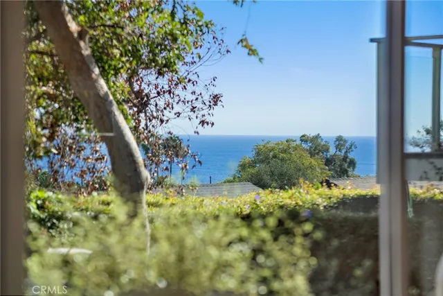 a kitchen with a stove a sink and a refrigerator