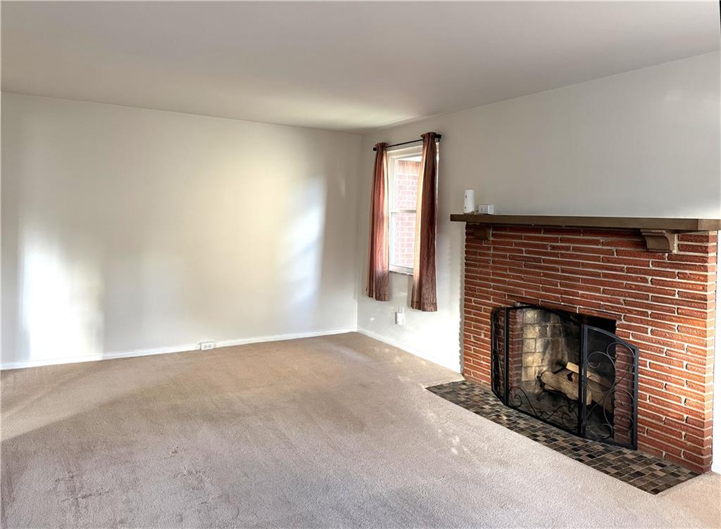 1533 Indiana Avenue Monaca, PA 15061 - Photo 3 of 27 an empty room with windows and fireplace