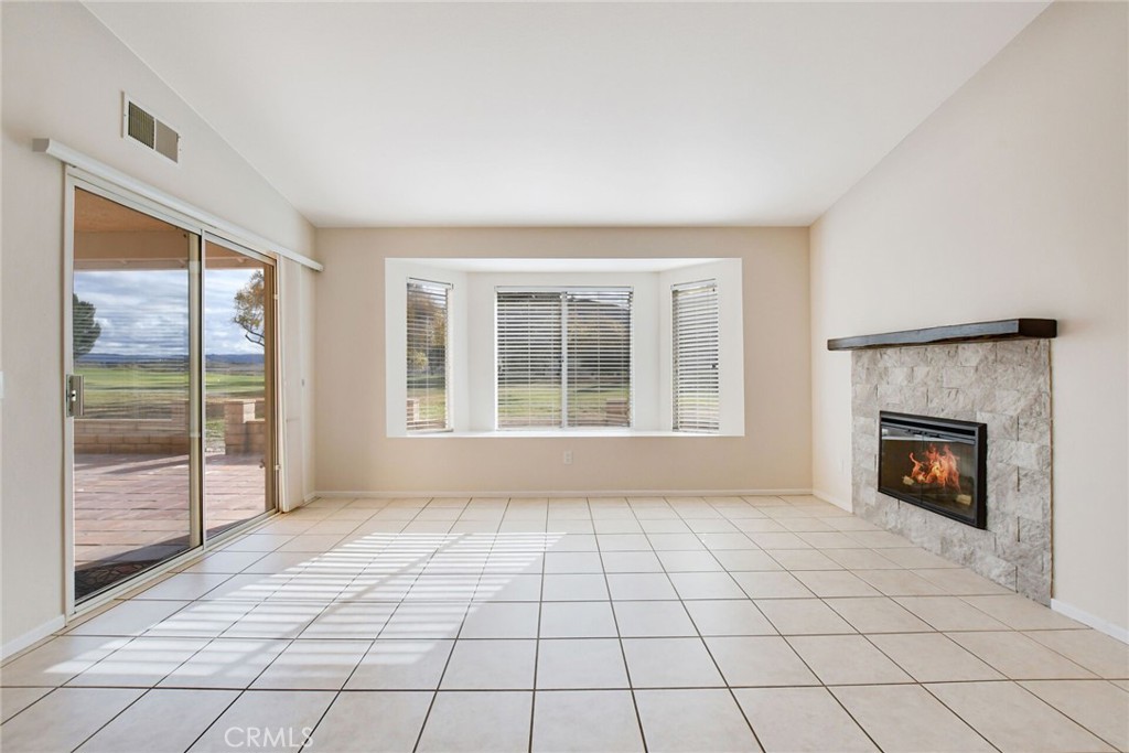 2787 Banyan Tree Lane Hemet, CA 92545 - Photo 13 of 36 a view of an empty room with glass door and a window