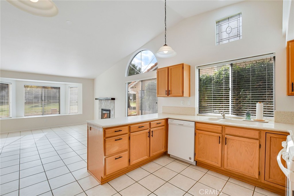 2787 Banyan Tree Lane Hemet, CA 92545 - Photo 18 of 36 a kitchen that has a lot of white cabinets and a window