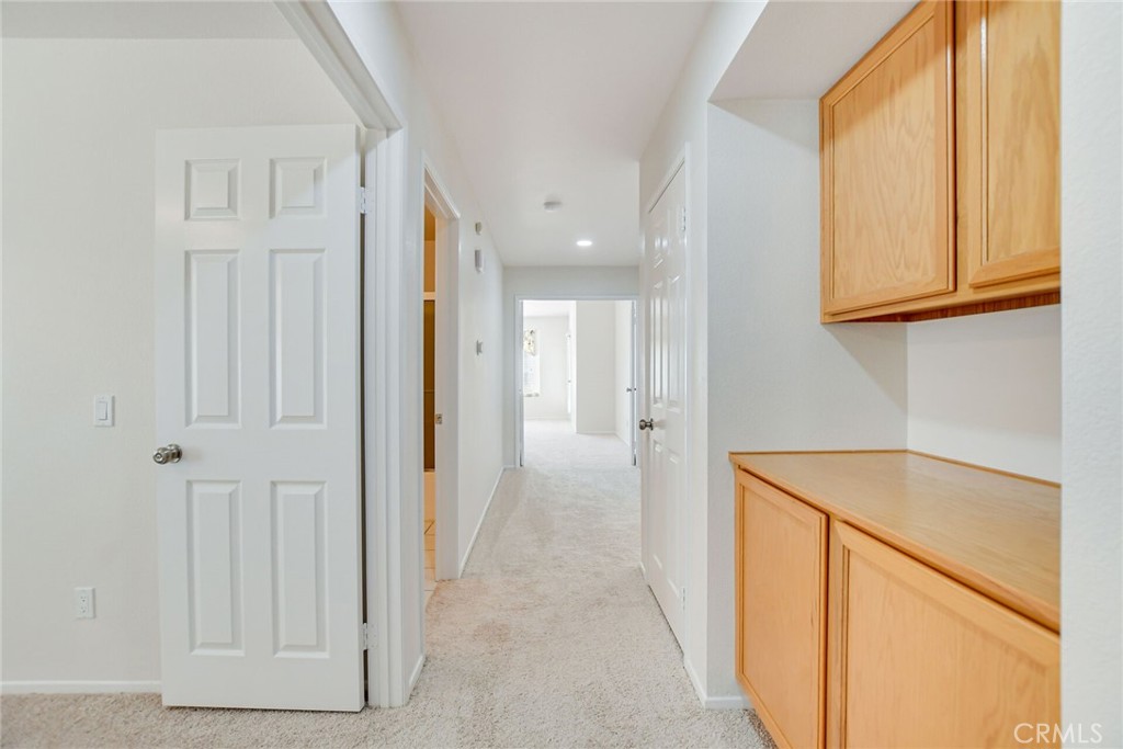2787 Banyan Tree Lane Hemet, CA 92545 - Photo 21 of 36 a view of a kitchen with wooden floor and staircase