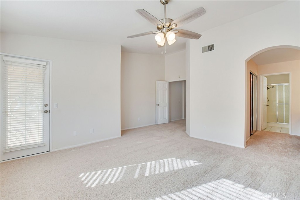 2787 Banyan Tree Lane Hemet, CA 92545 - Photo 24 of 36 an empty room with windows and fan