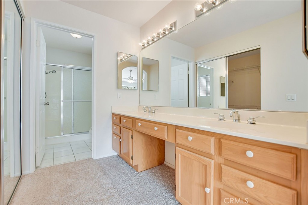 2787 Banyan Tree Lane Hemet, CA 92545 - Photo 25 of 36 a spacious bathroom with a double vanity sink mirror and double