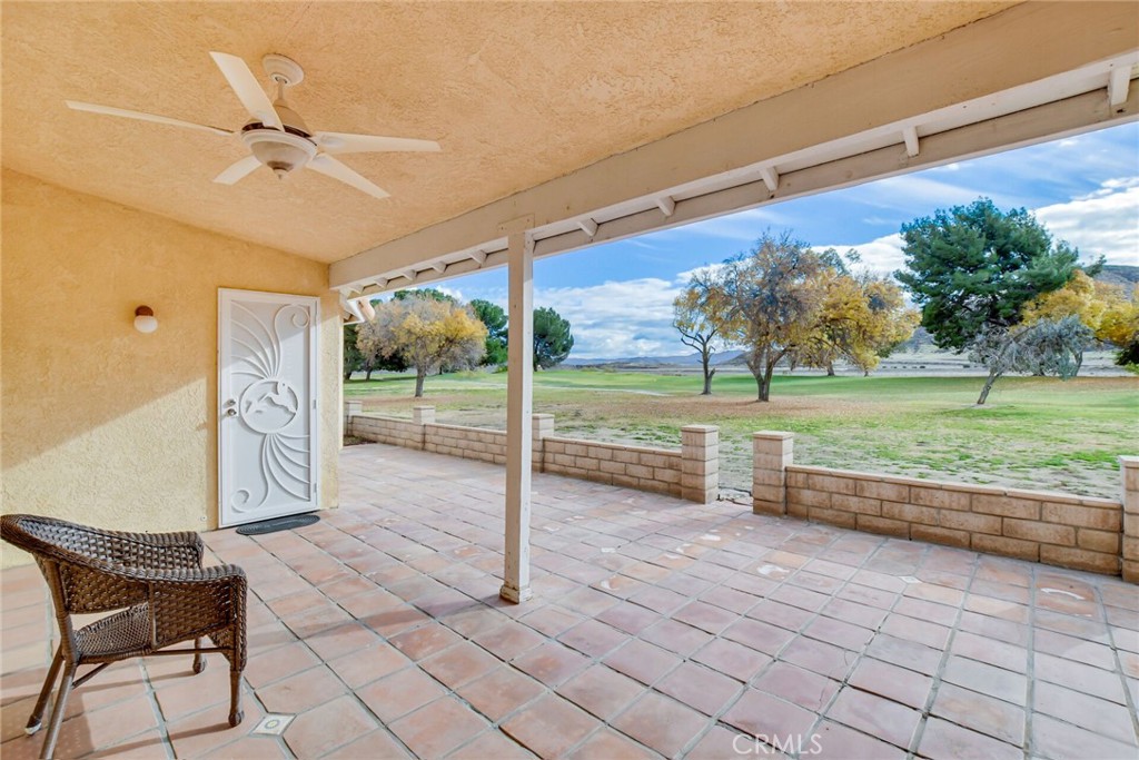 2787 Banyan Tree Lane Hemet, CA 92545 - Photo 30 of 36 a view of a porch with furniture and a yard