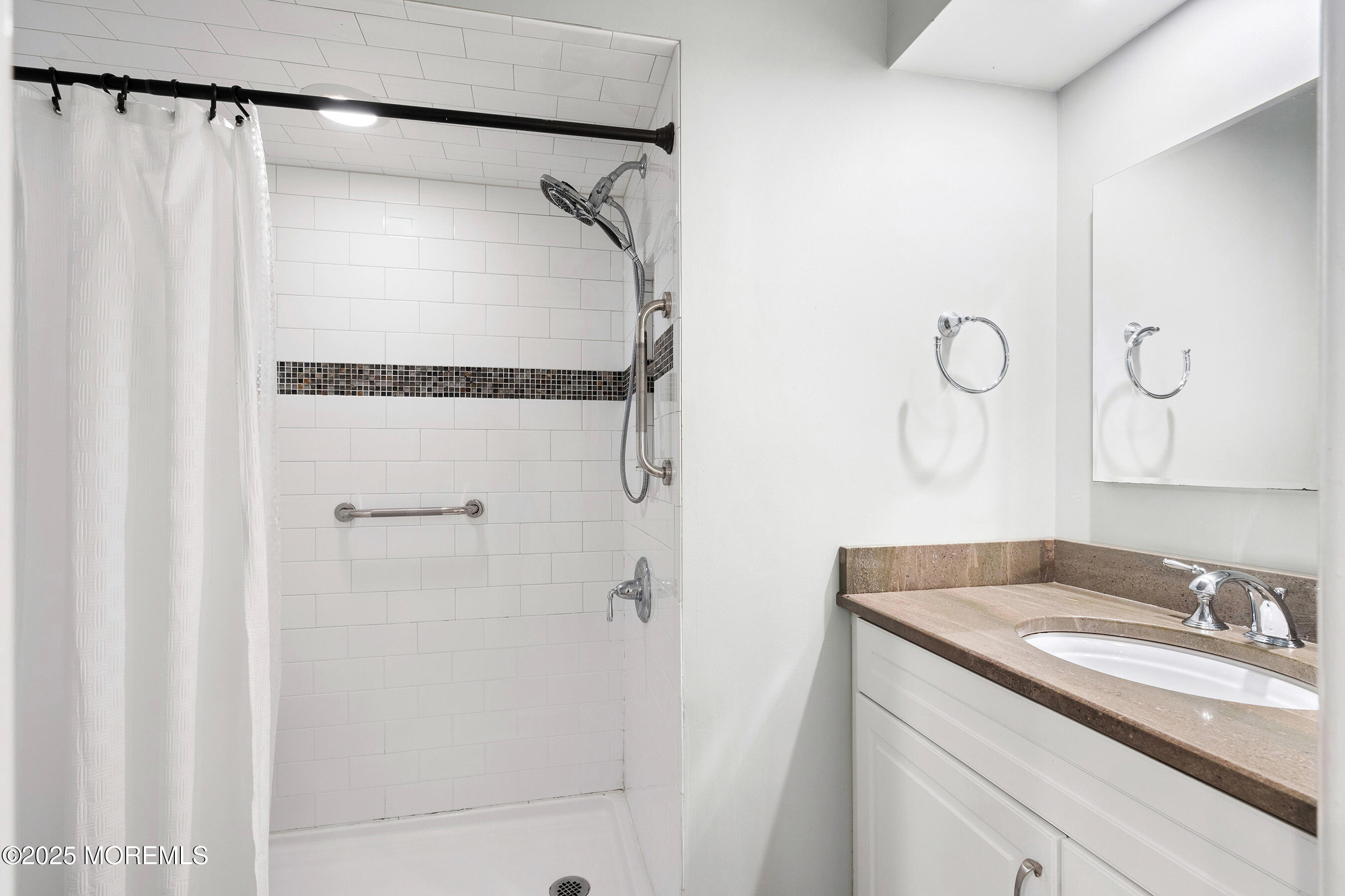 19 Manchester Court Red Bank, NJ 07701 - Photo 15 of 19 a bathroom with a granite countertop sink and shower