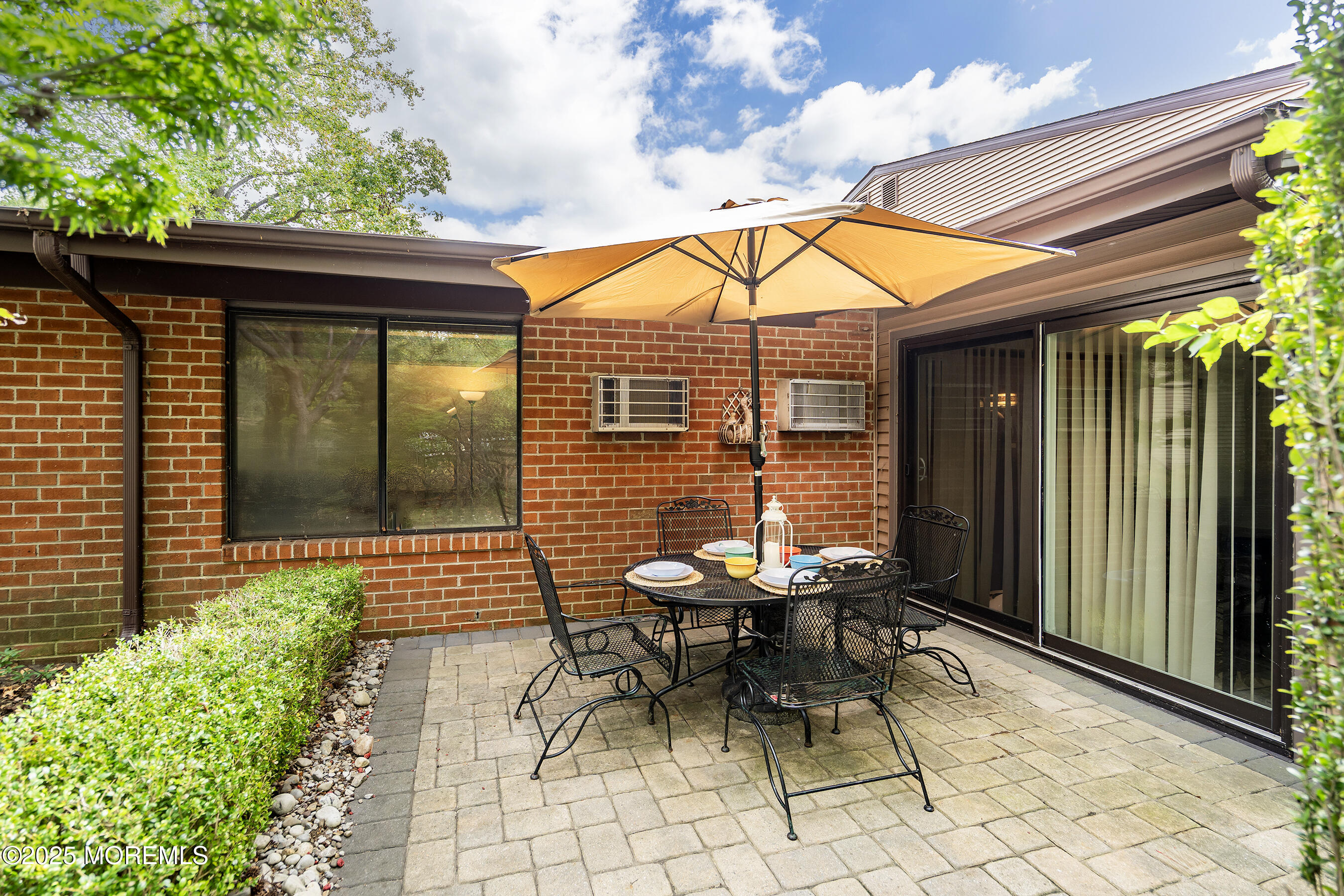 19 Manchester Court Red Bank, NJ 07701 - Photo 18 of 19 a backyard of a house with a table and chairs