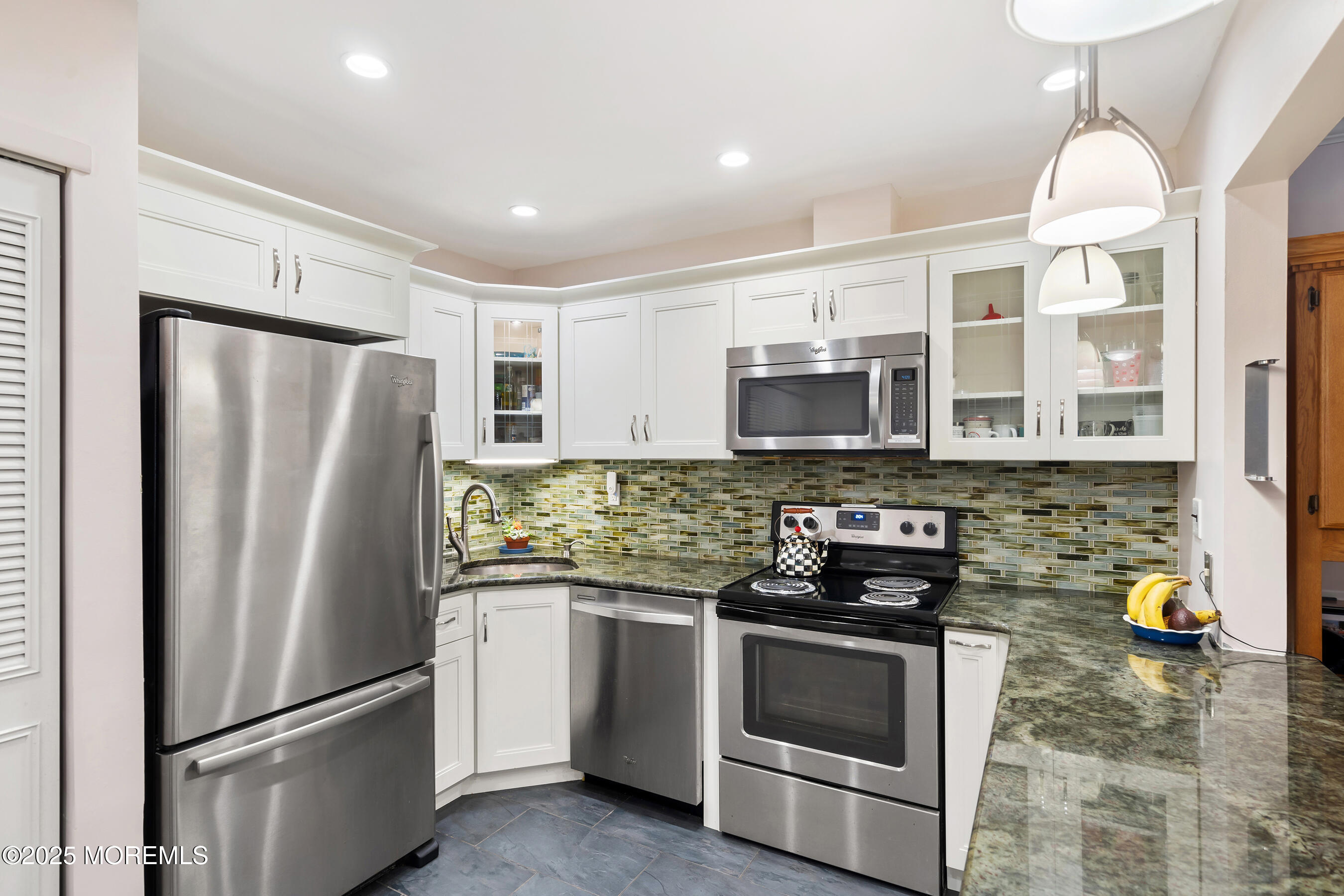 19 Manchester Court Red Bank, NJ 07701 - Photo 9 of 19 a kitchen with stainless steel appliances granite countertop a refrigerator a stove and a sink