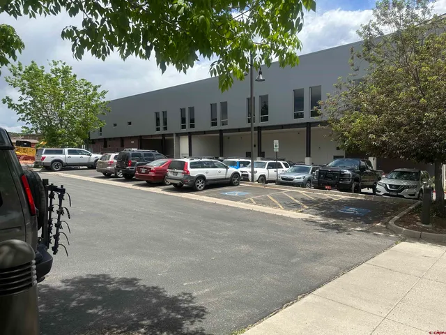 a view of a park with sitting area