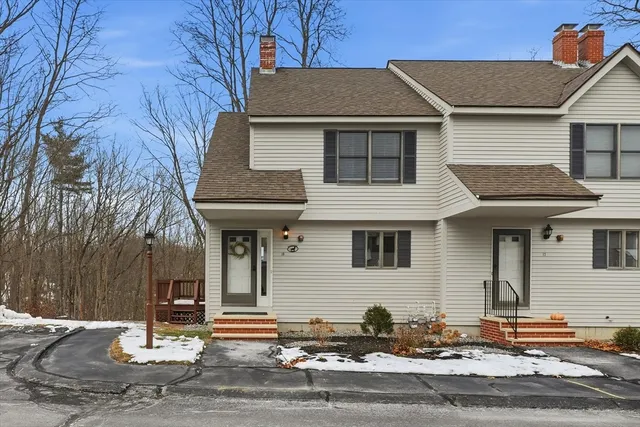 a front view of a house with garage