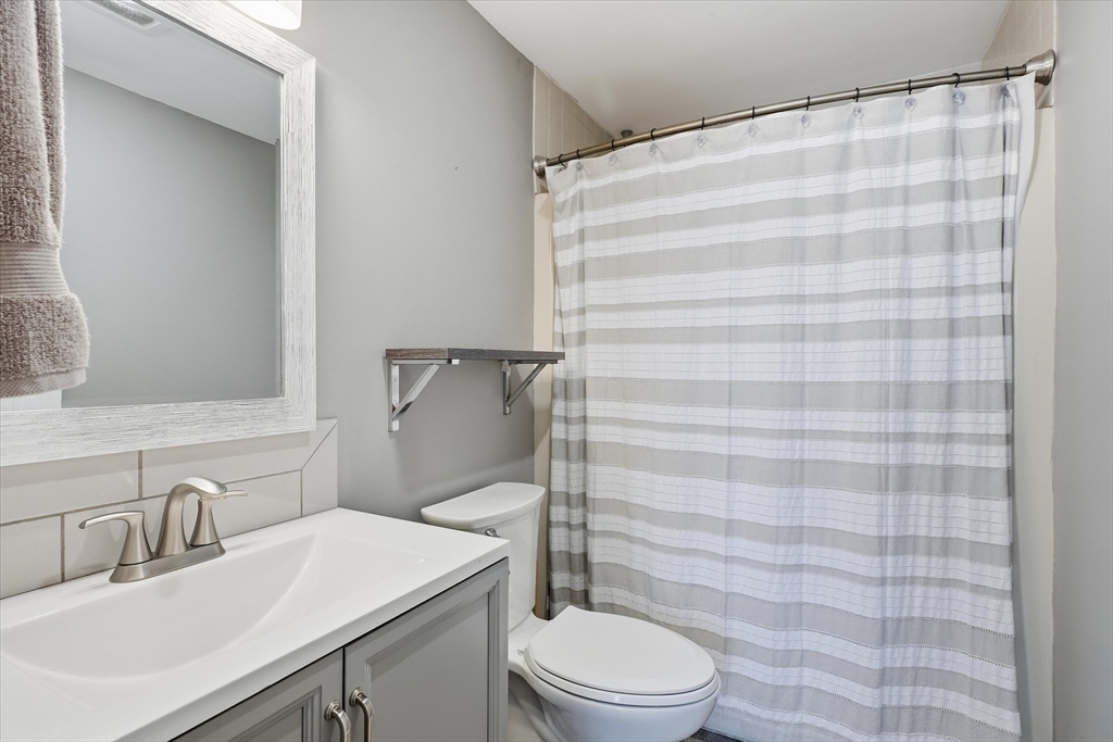 18 Carriage Court, Unit 18 Merrimac, MA 01860 - Photo 21 of 38 a bathroom with a sink a toilet and shower