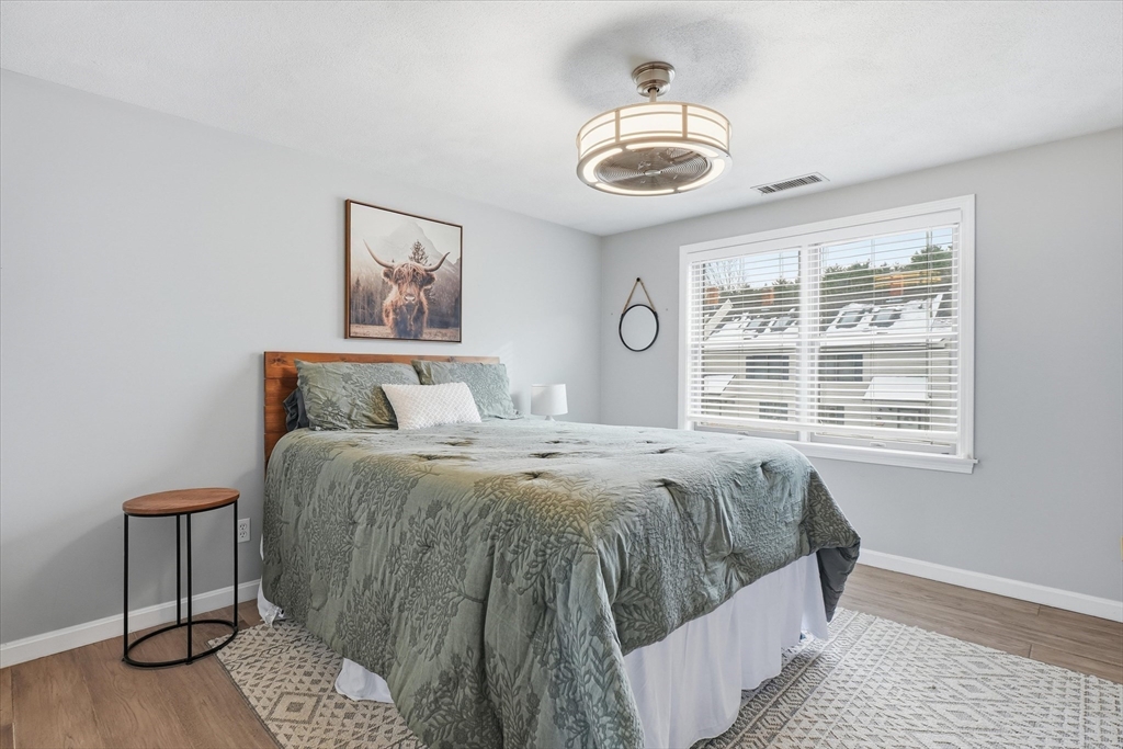 18 Carriage Court, Unit 18 Merrimac, MA 01860 - Photo 22 of 38 a bedroom with a bed and a window