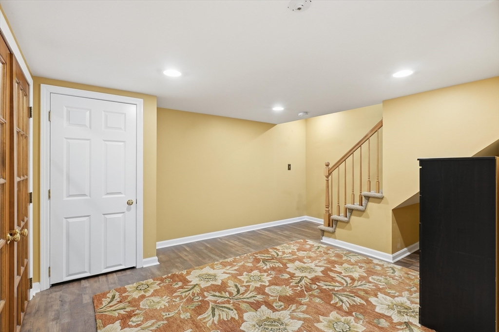 18 Carriage Court, Unit 18 Merrimac, MA 01860 - Photo 26 of 38 a view of a livingroom with a staircase