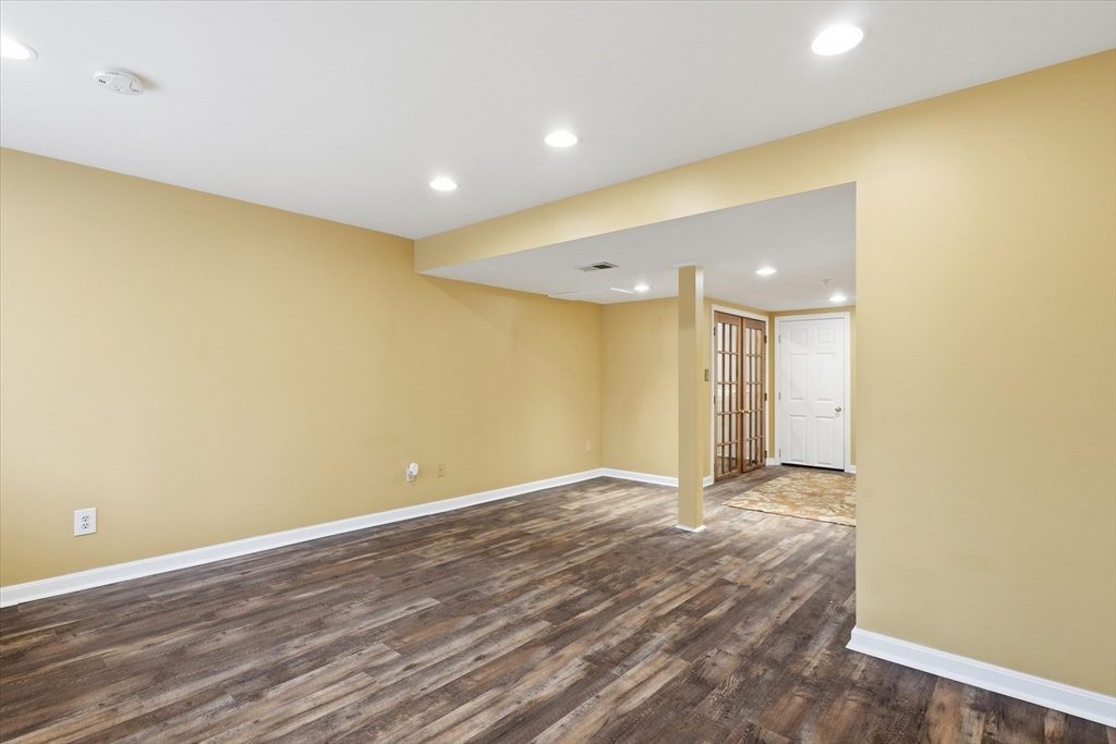 18 Carriage Court, Unit 18 Merrimac, MA 01860 - Photo 28 of 38 a view of an empty room with wooden floor