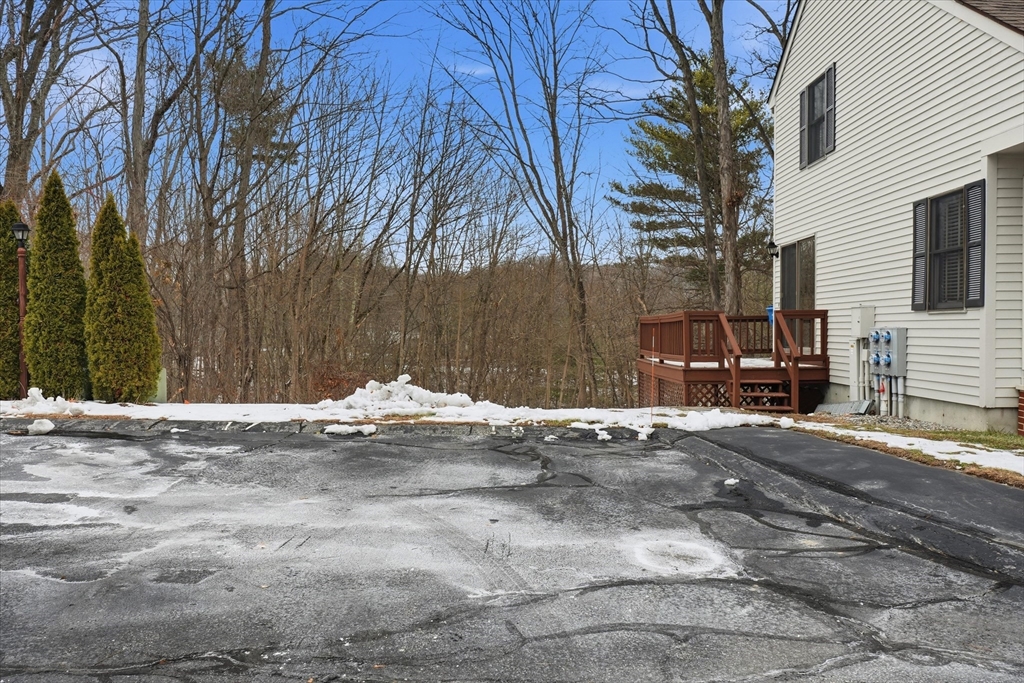 18 Carriage Court, Unit 18 Merrimac, MA 01860 - Photo 32 of 38 a view of a backyard with large trees