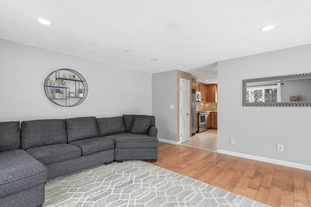 18 Carriage Court, Unit 18 Merrimac, MA 01860 - Photo 10 of 38 a living room with furniture and a window