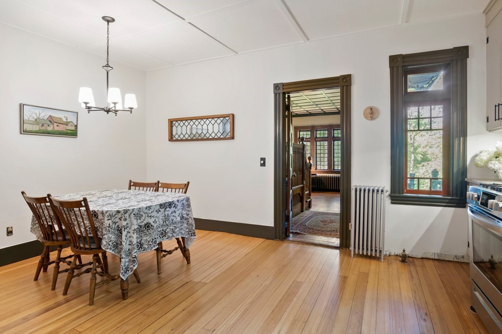 201 Winchester Road Northfield, MA 01360 - Photo 10 of 30 a view of a dining room with furniture wooden floor and a chandelier