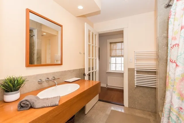 a spacious bathroom with sink and bathtub