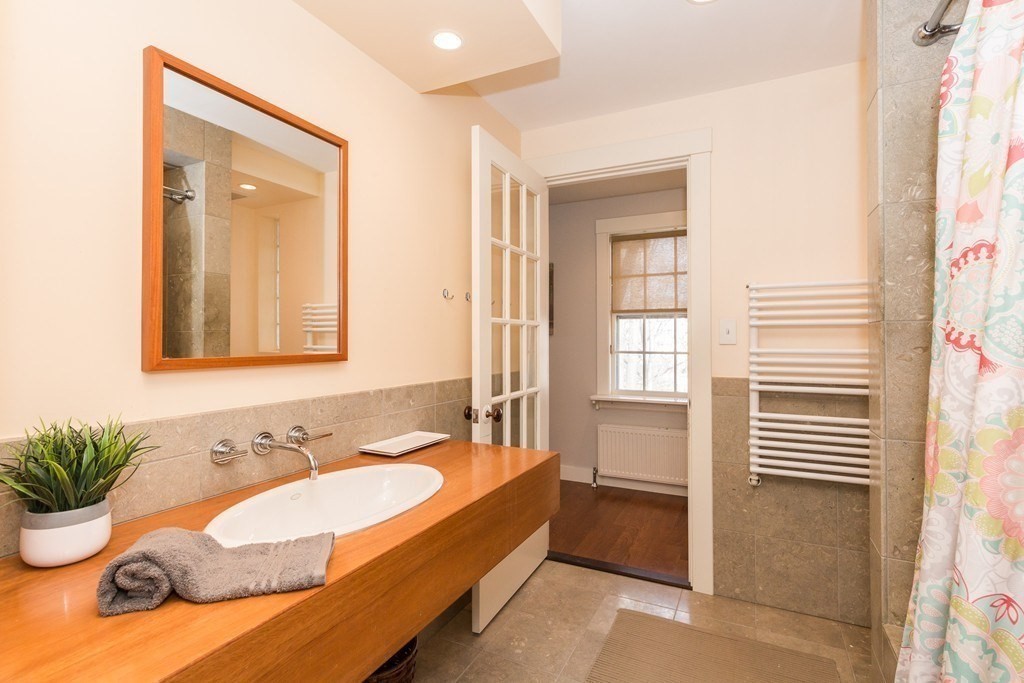 12 Willow Court, Unit A Arlington, MA 02476 - Photo 11 of 16 a spacious bathroom with sink and bathtub
