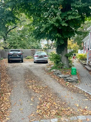 a view of a house with yard and sitting area