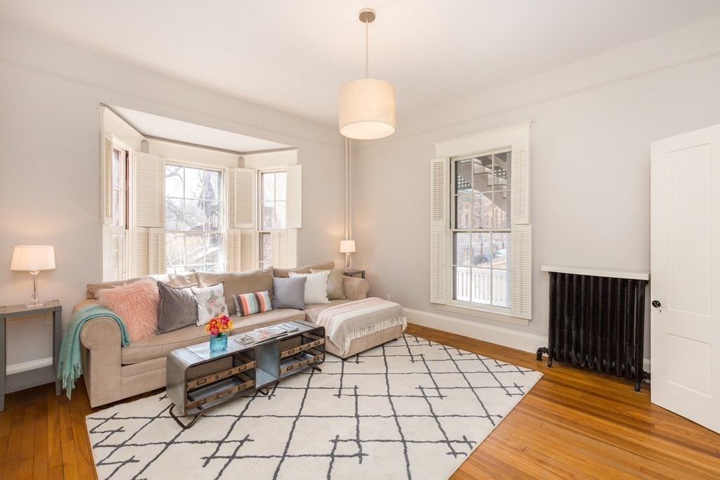 12 Willow Court, Unit A Arlington, MA 02476 - Photo 6 of 16 a living room with furniture and a window