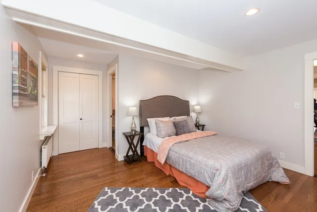 a bedroom with a bed and a lamp