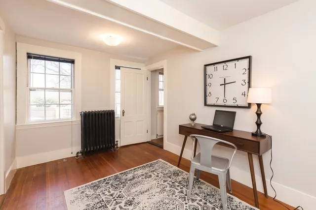 a workspace with furniture and window