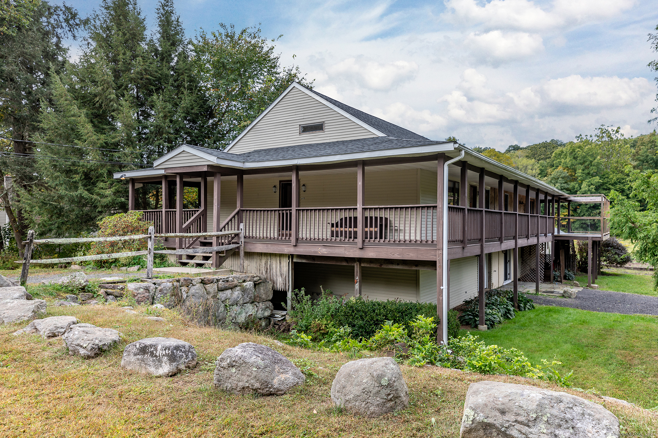 a front view of a house with garden