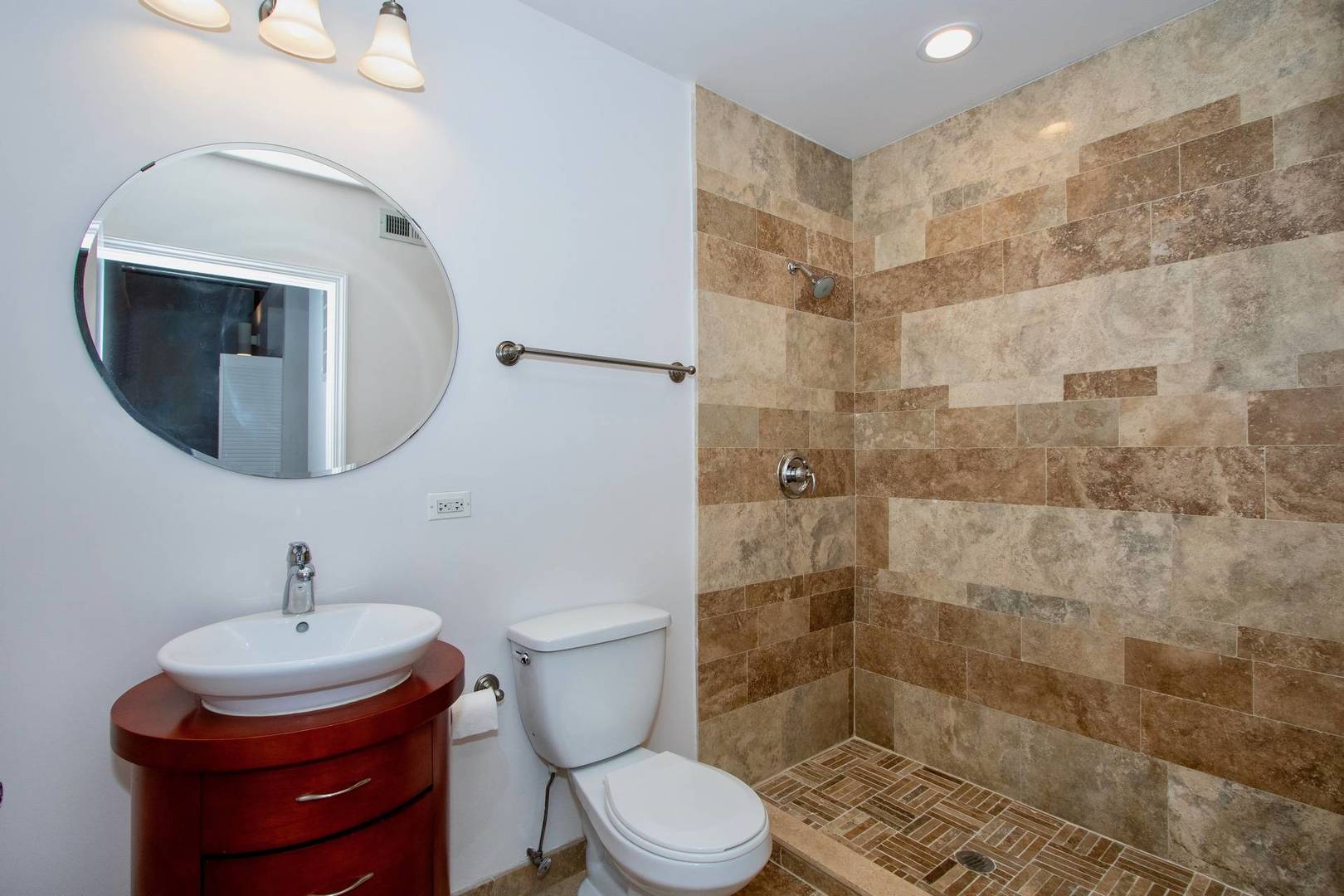 2545 South Dearborn Street, Unit 608 Chicago, IL 60616 - Photo 15 of 28 a bathroom with a toilet sink and shower