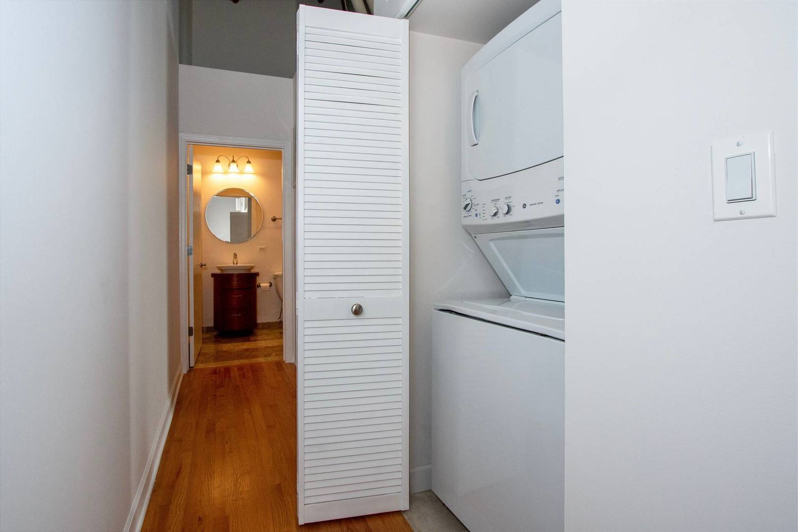 2545 South Dearborn Street, Unit 608 Chicago, IL 60616 - Photo 16 of 28 a view of a hallway with washer and dryer