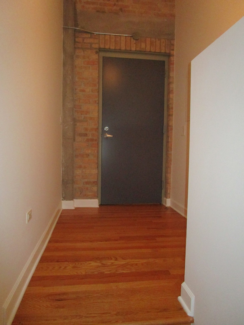 2545 South Dearborn Street, Unit 608 Chicago, IL 60616 - Photo 26 of 28 a view of a small space with wooden floor