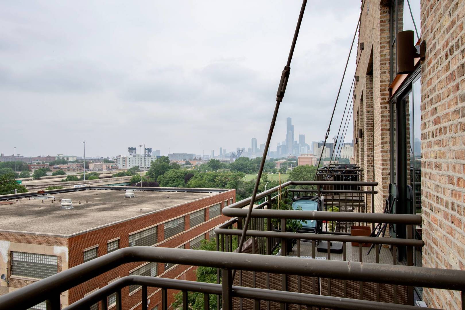 2545 South Dearborn Street, Unit 608 Chicago, IL 60616 - Photo 8 of 28 a view of a city skyline from a balcony