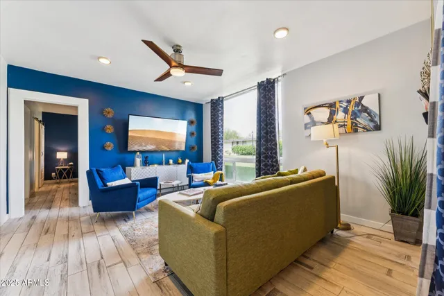 a living room with furniture and a flat screen tv