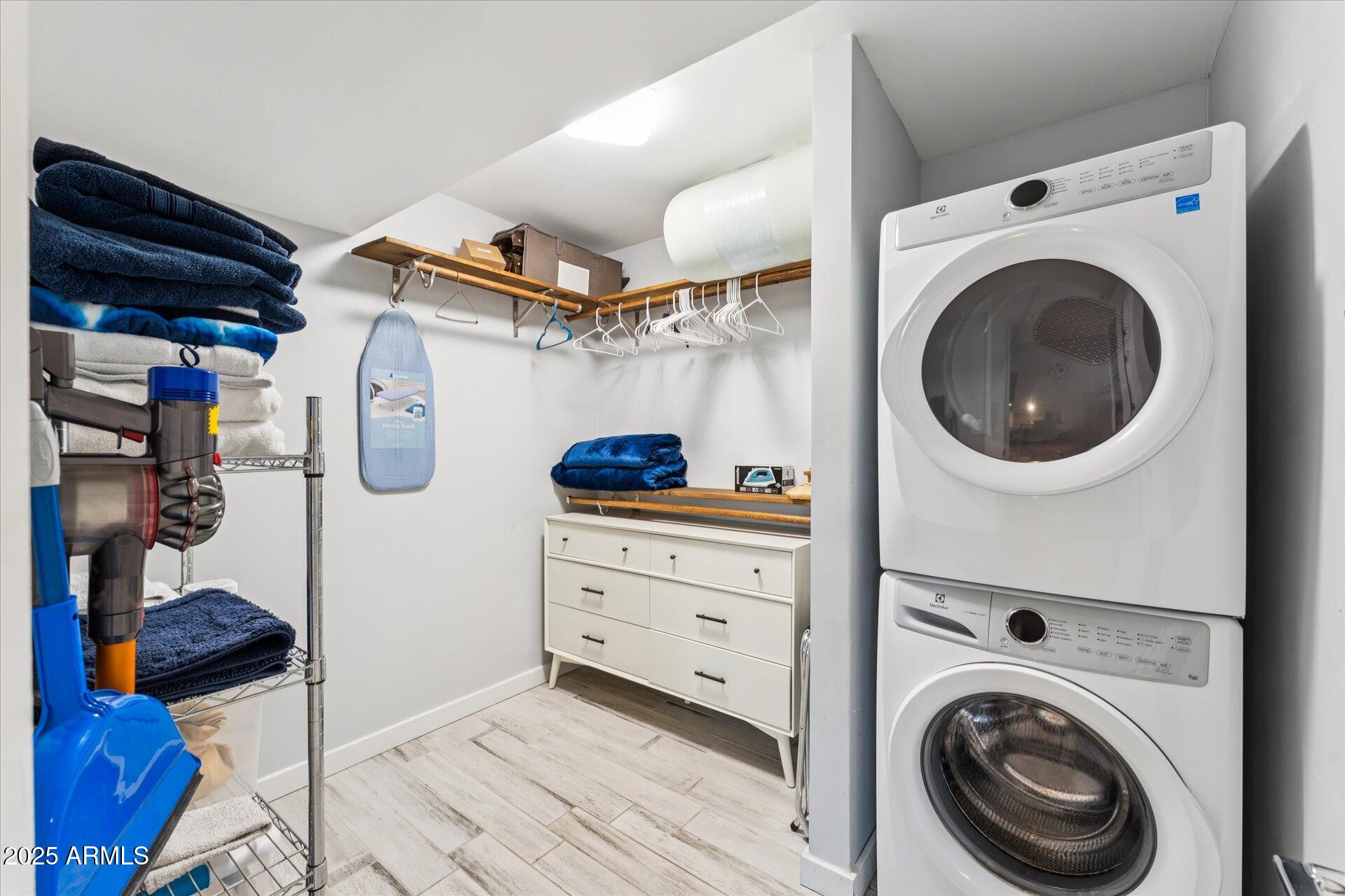 3242 East Camelback Road, Unit 105 Phoenix, AZ 85018 - Photo 19 of 24 a view of a storage & utility room with washer and dryer