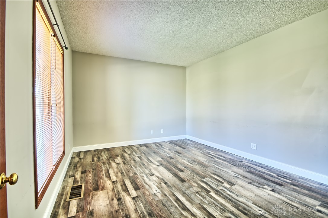 8711 Nicole Lane Springboro, OH 45066 - Photo 26 of 87 This versatile room boasts wood flooring and ample natural light, ready for your personal touch.