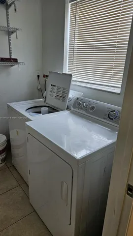 a bedroom with a bed and a table