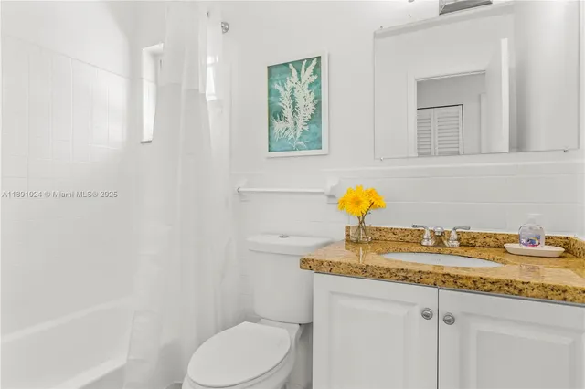 a bedroom with a bed and a table in it