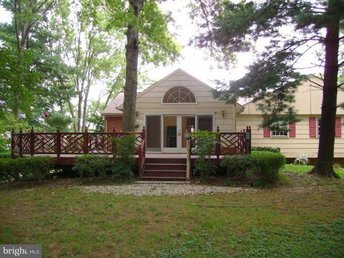 19404 Charline Manor Road Olney, MD 20832 - Photo 2 of 5 View of sunroom from back yard