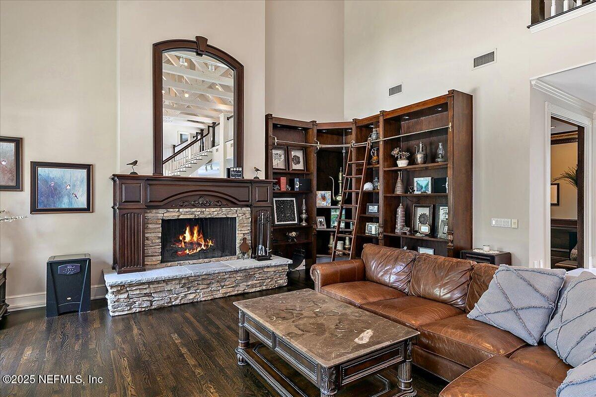 12827 Fort Caroline Road Jacksonville, FL 32225 - Photo 12 of 42 a living room with furniture and a fireplace
